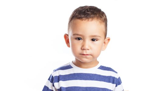 child holding a chalkboard on white background